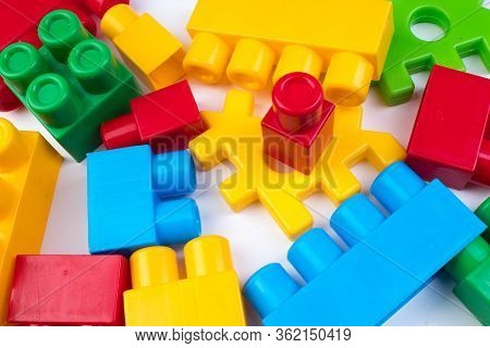 Lot Of Colorful Rainbow Toy Bricks Background. Educational Toy For Children Isolated On White Backgr