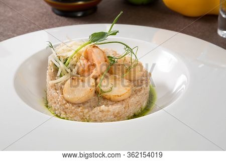 Scallops And Shrimps Served With Brown Rice