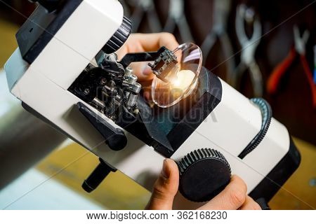 Manufacturing Process. Eyehealth Care. Polishing Lenses In Optical Shop. Producing Eyeglasses.