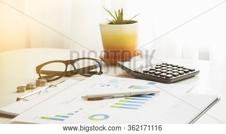 Business Concept With Copy Space. Office Desk Table With Glasses Focus And Analysis Chart Computer N