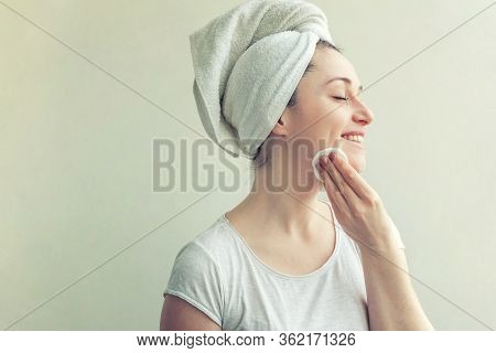 Beauty Portrait Of Smiling Woman In Towel On Head With Soft Healthy Skin Removing Make Up With Cotto