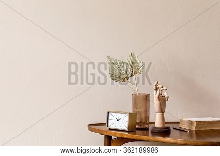 Stylish Composition On The Design Wooden Table With Gold Clock, Wooden Hand And Paper Flowers In Vas