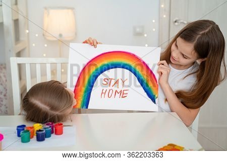 Girls Drawing On A White Sheet Rainbow And Write Stay Home. Flashmob Chasetherainbow.