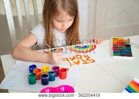 Child Girl With Blond Hair Drew A Rainbow And A Poster Stay Home. Flashmob Chasetherainbow.