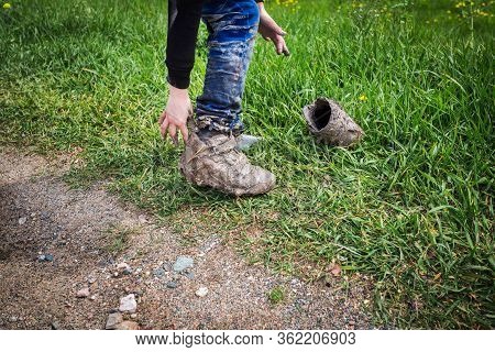 The Kids In The Mud. Very Dirty Shoes, Jeans And Hands. Feet In Clay. Dirty Clothing And Boots. Chil