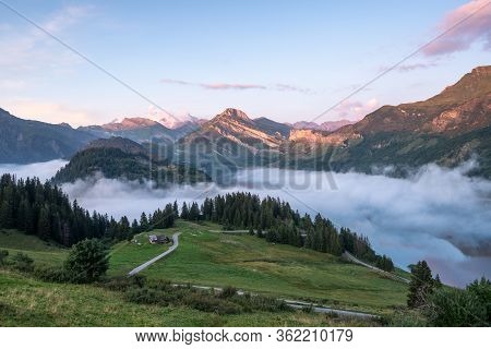 Sea Clouds By A Lake In The Mountains In The French Alps.