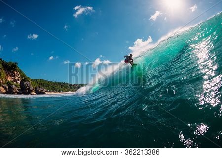 June 2, 2019. Bali, Indonesia. Surfer Ride On Barrel Wave. Professional Surfing At Padang Padang
