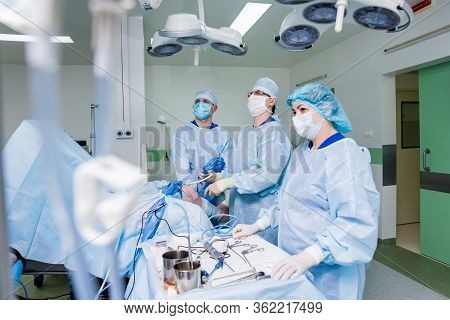 Arthroscope Surgery. Orthopedic Surgeons In Teamwork In The Operating Room