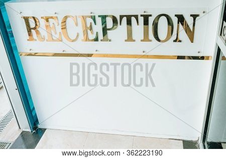 Hotel Desk Reception With The Inscription. White Tabel