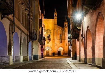 Piazza Risorgimento And Via Cavour, Main Square Of Alba (piedmont, Italy) At Night With The Facade O