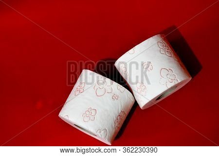 Roll Of Toilet Paper On Red Background