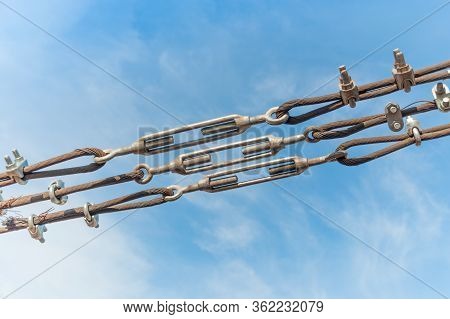 Close Up Steel Turnbuckle And Sling Steel In Construction Site On A Blue Sky Background