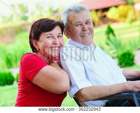 Portrait Of Happy Old Father And His 50 Years Daughter At Nurising Home