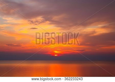 Background Of Colorful Sky Concept: Dramatic Sunset With Orange Color Sky And Clouds.