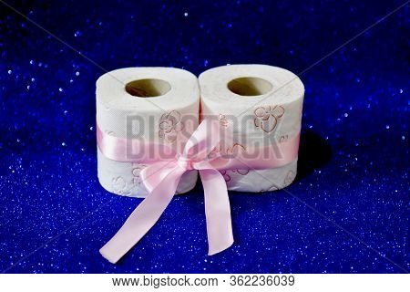 Rolls Of Toilet Paper On Glitter Blue Background