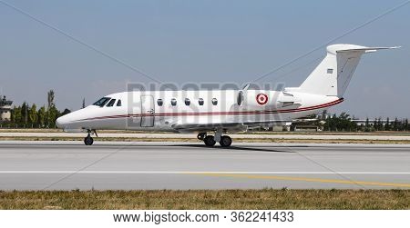 An White Private Jet Taxi On Runway