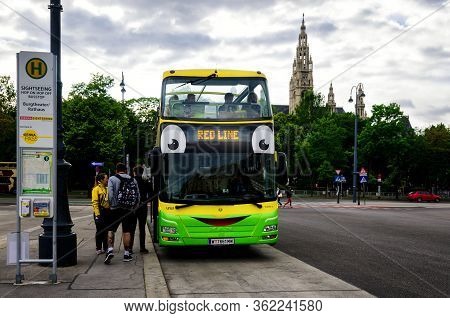 Vienna, Austra - May 20, 2017: Red Line Of Vienna Sightseeing Bus With Tourists Getting On At Burgth