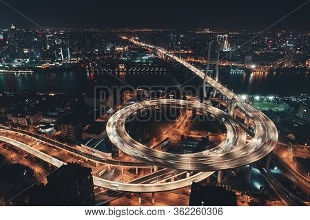Shanghai Nanpu Bridge over Huangpu River with busy traffic in China.