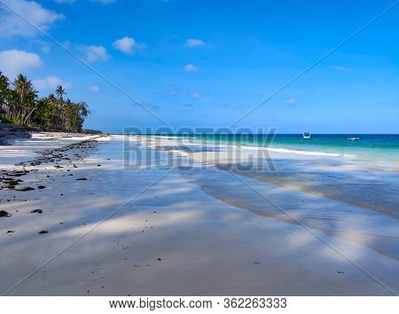 Tropical White Sand Beach At Sunrise. Diani Beach, Kenya. It Is A Beautiful Long Beach In Africa.