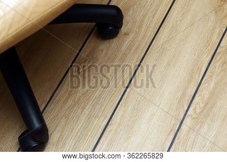 Office Chair, On The Parquet Floor With Black Seams