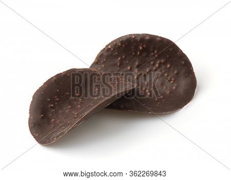 Cripsy dark chocolate wave chips isolated on white