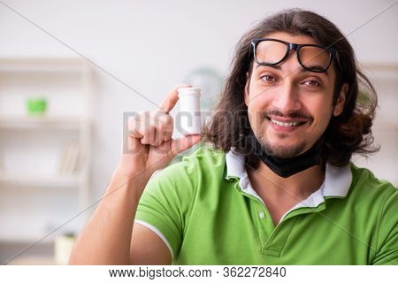 Young man student studying at home in self-isolation concept