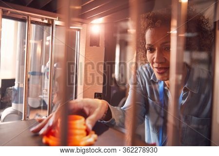 Mature Female College Student Studying Engineering Using 3D Printing Machine