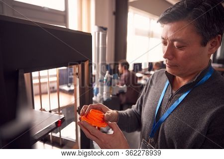 Mature Male College Student Studying Engineering Using 3D Printing Machine