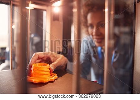Mature Female College Student Studying Engineering Using 3D Printing Machine