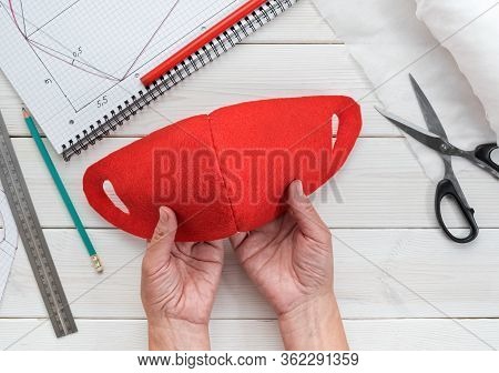 Female Hands Hold A Home-made Antiviral Mask During Isolation And Outbreak Of The Virus. Step-by-ste