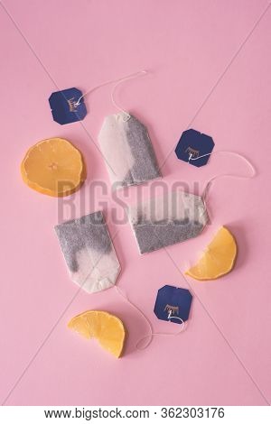 Three Bags Of Black Tea With Lemon Slices On A Pink Background. Fresh Tea, Tea Party. The View From 