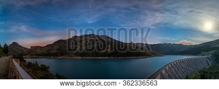 Lake With Mountains During Blue Hour In The French Alps.