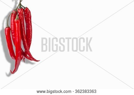 Red Chilli Pods On A White Isolated Background