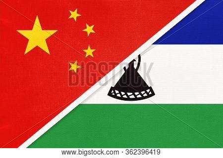 China Or Prc Vs Kingdom Of Lesotho National Flag From Textile. Relationship Between Asian And Africa