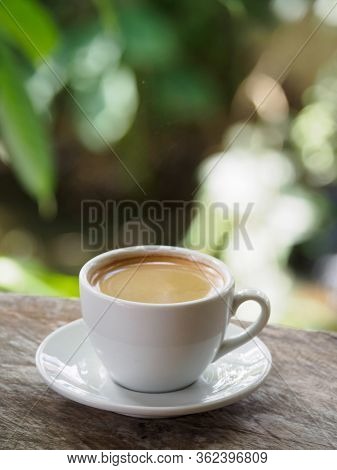 Hot Coffee Americano On The Old Wooden Table