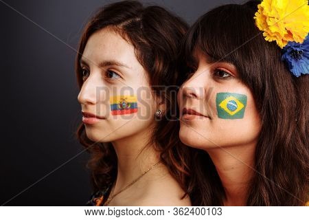 Brazilian And Ecuadorian Ladies With Body Art On Their Faces Looking Forward. Colorful Painting. Sel