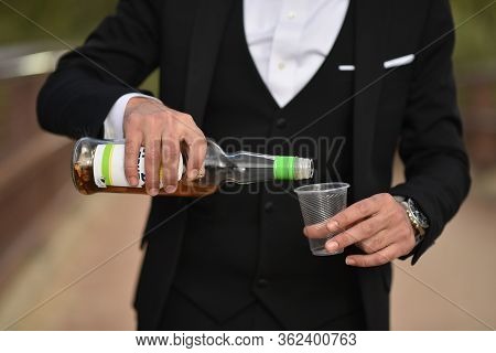 Vodka On Hands Close-up, Dressing, Man's Style, Stylish Man. Elegant Young Handsome Man. Men's Jacke
