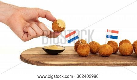 Dutch Traditional Snack Bitterbal In A Hand, Isolated