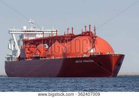Swinoujscie, West Pomeranian / Poland - 2019: The Beautiful Red Lng Arctic Princess Tanker Flows To 