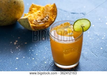 Exotic Fruit Juice From Bel Fruit Or Wooden Apple Called In India Bel Ka Sharbat. Cold Fruit Drink W
