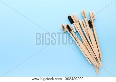 Zero Waste And Without Plastic Concept. Set Of Eco Friendly Bamboo Toothbrushes On Light Pastel Blue