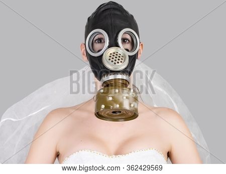 Cyberpunk Bride In Veil Dress And Protective Gas Mask And Veil Posing.
