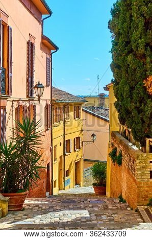 Picturesque old colorful street in Santarcangelo di Romagna town on sunny day, Rimini, Italy -- Italian cityscape