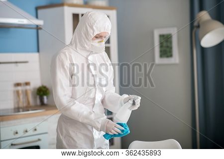 Woman In White Workwear Standing In The Kitchen