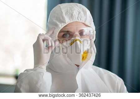 Woman In White Workwear Wearing Protective Eyeglasses