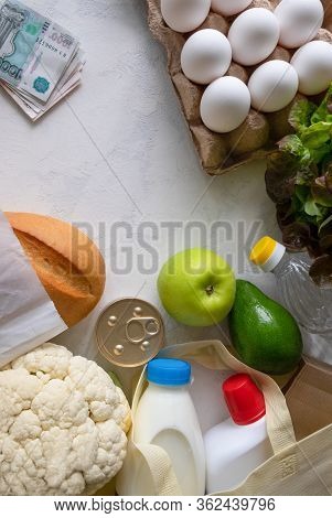 Flat Lay From A Set Of Different Products And A Few Russian Banknotes On A Light Surface. Delivery O