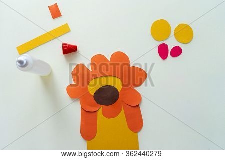 A Child Makes A Lion From Paper And Cardboard. Master Class, Diy, Animals Of Africa, Yellow Color. H