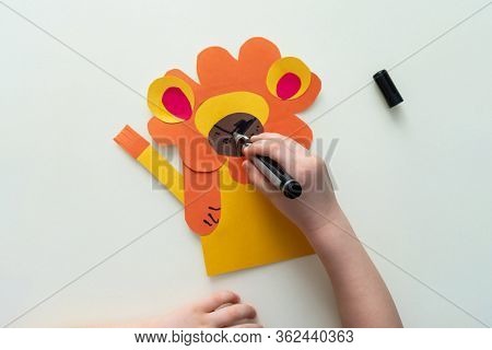 A Child Makes A Lion From Paper And Cardboard. Master Class, Diy, Animals Of Africa, Yellow Color. H