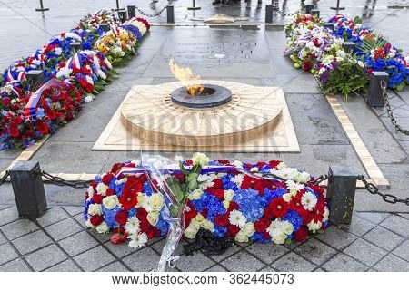 Paris, France - May 8, 2019: Flowers And Eternal Flame Near Arc De Triomphe In Honor Of Victory Over