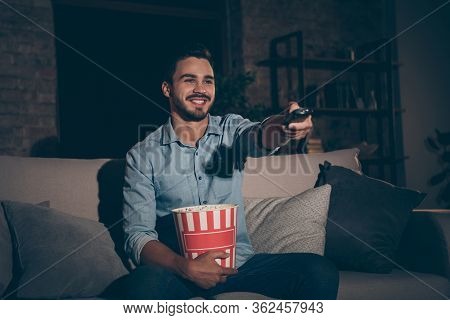 Portrait Of His He Nice Attractive Cheerful Cheery Brunet Guy Spending Holiday Sitting On Divan Watc